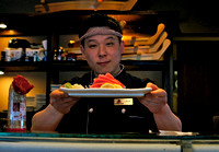 John serving Wild Salmon Sashimi